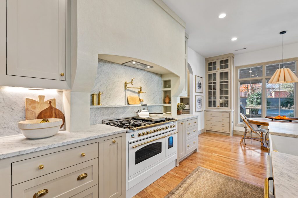 Remodeled kitchen with a professional range and tile backsplash in Northwest Arkansas